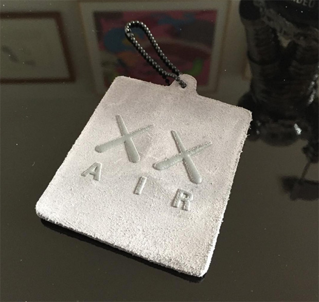 Kaws Jordan 4 Suede Hangtag