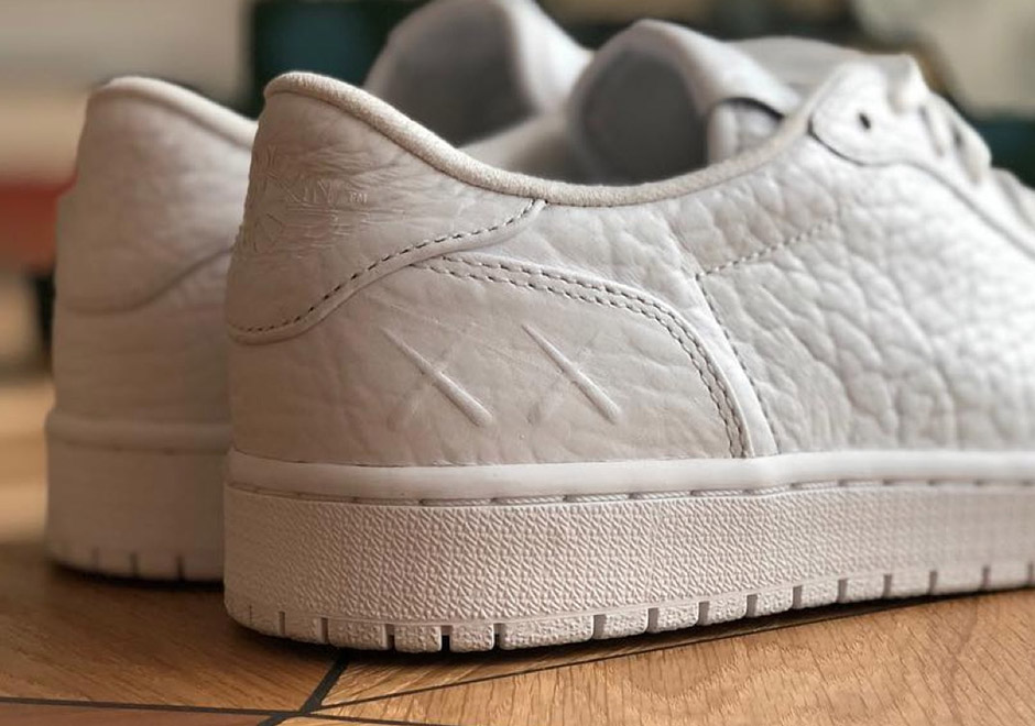 Kaws Air Jordan 1 Low Swooshless Pe