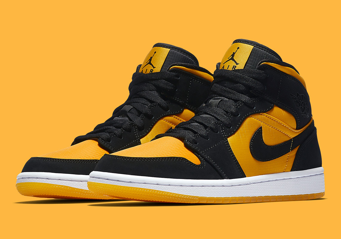 The Air Jordan 1 Mid Appears In University Gold