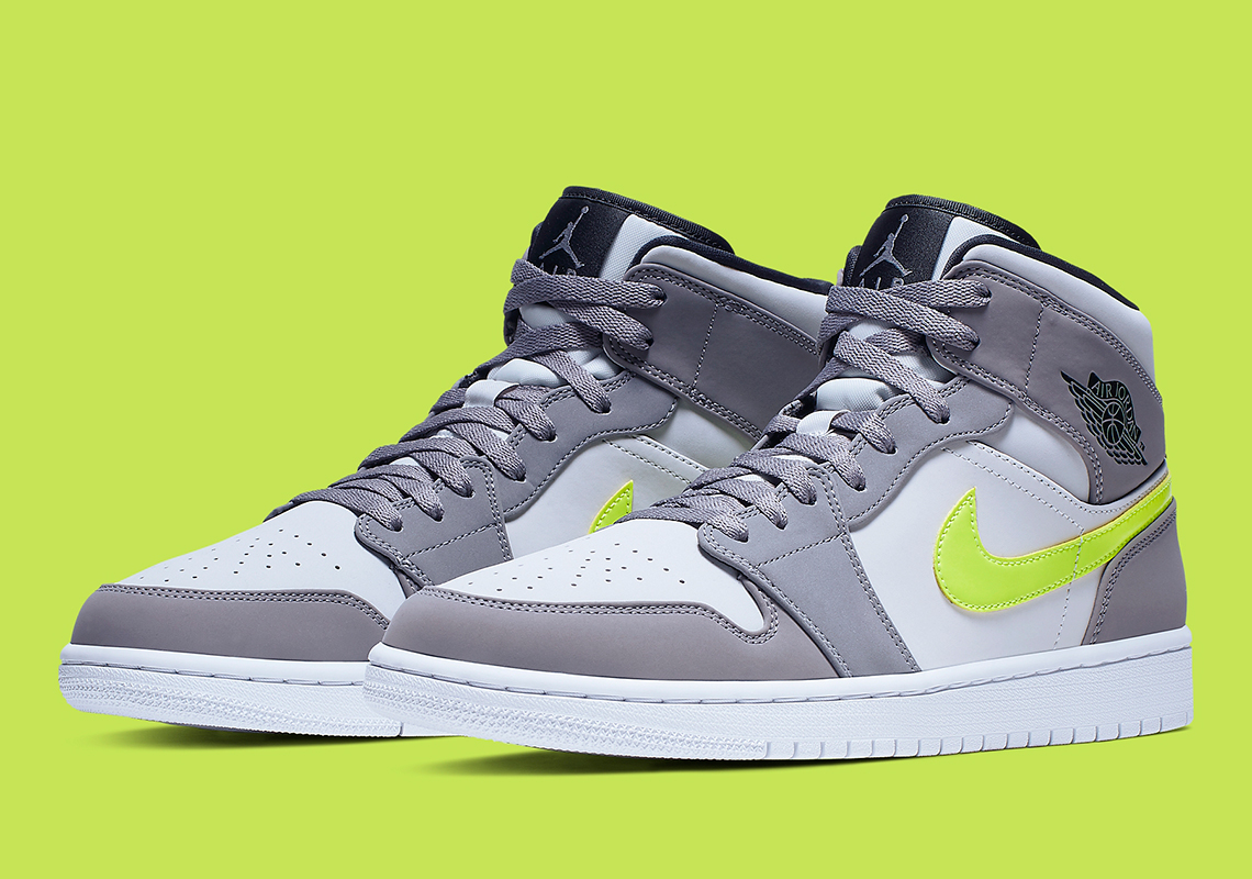 The Ubiquitous Air Jordan 1 Mid Appears In Grey And Volt