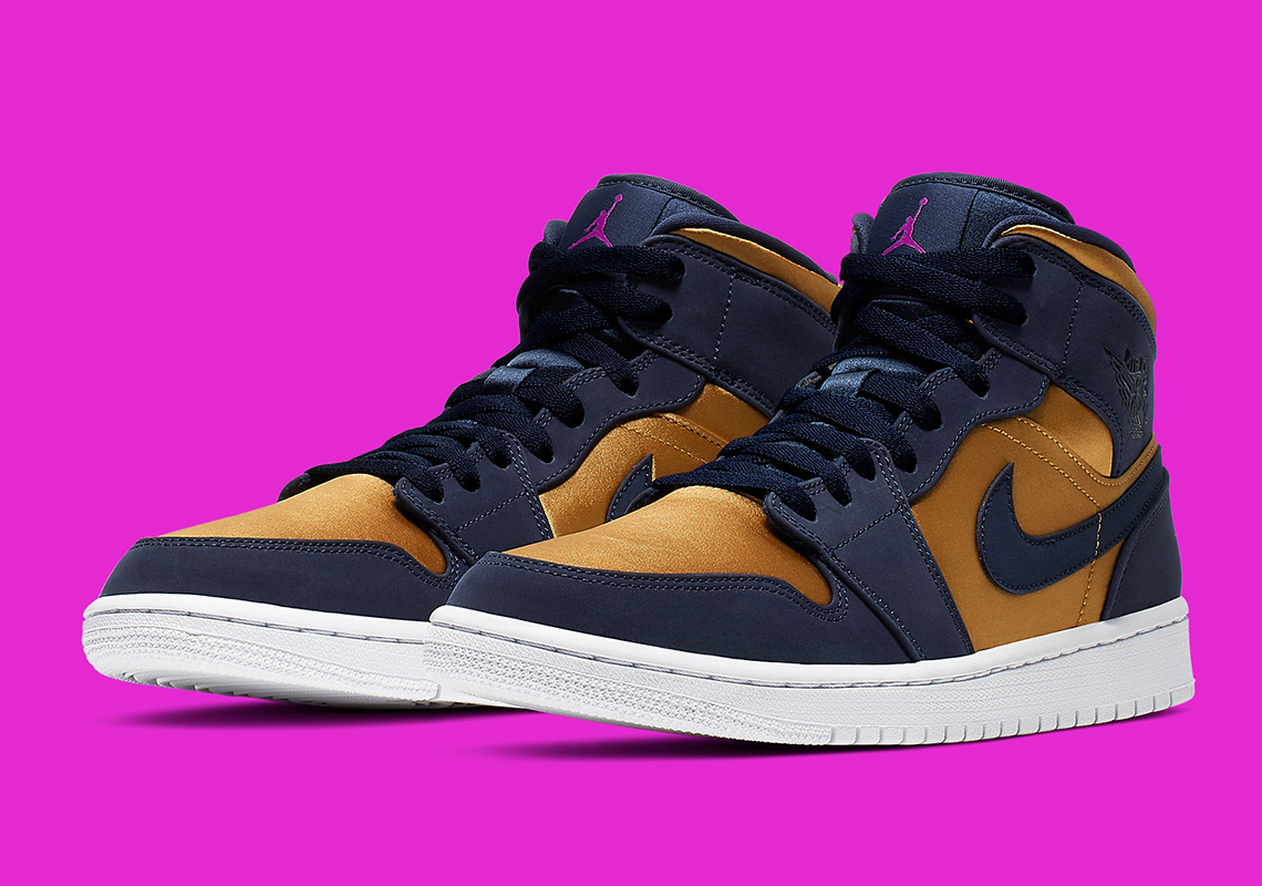 The Air Jordan 1 Mid Pairs Navy With A Satin Gold Finish