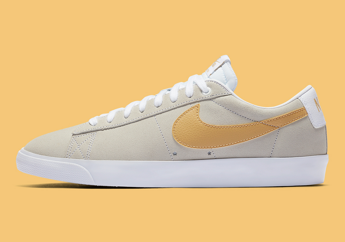 The Nike SB Blazer Low Pairs Light Grey With Yellow Swooshes