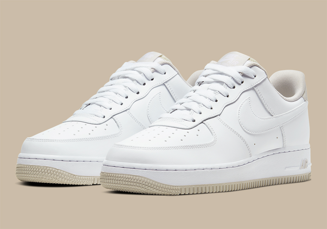 The Nike Air Force 1 Accents A Triple White Upper With Light Bone Accents