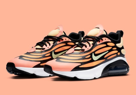 The Nike Air Max 200 Features An Anatomical Web Above A Bright Orange Shell