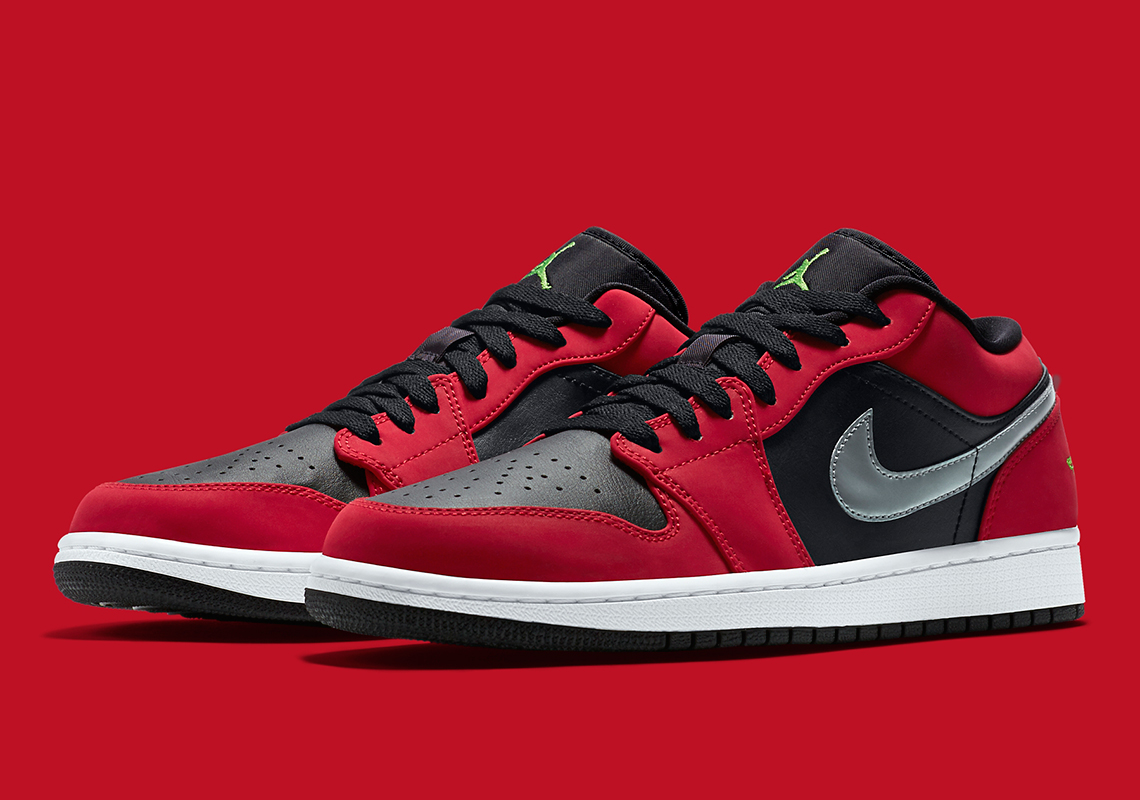 The Air Jordan 1 Low Pairs Bred-Style Uppers With Metallic Swooshes