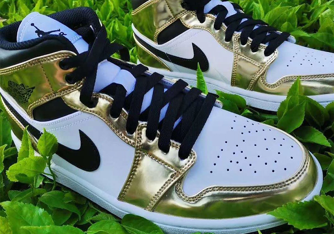 The Air Jordan 1 Mid Appears With Metallic Gold Overlays