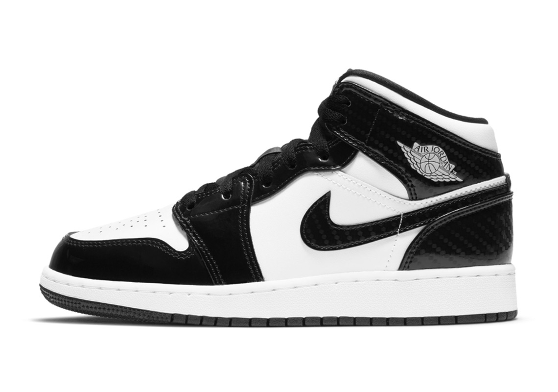 The Air Jordan 1 Mid Gets Black Carbon Fiber Patterned Overlays