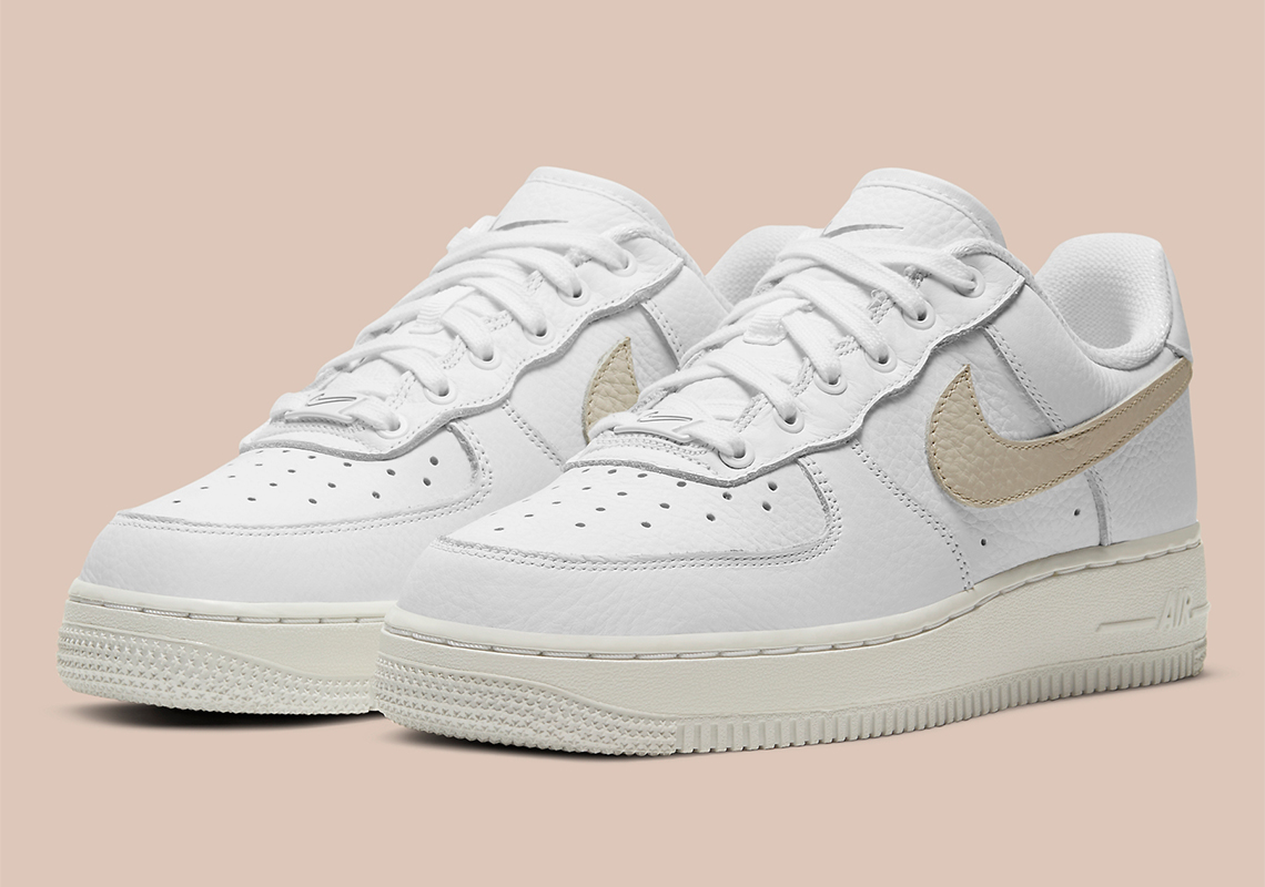 The Women's Nike Air Force 1 Low "Light Bone" Features Swoosh Stencils