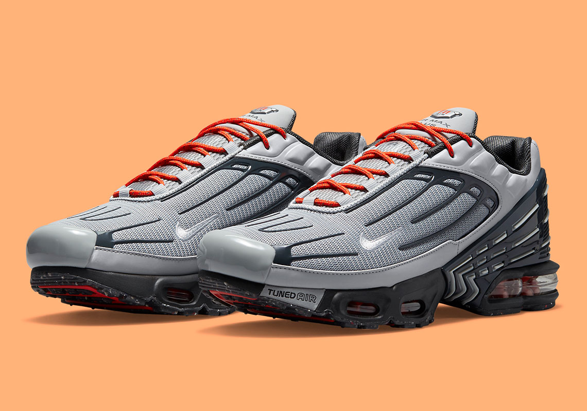 This Stoic Grey And Navy Nike Air Max Plus 3 Gets Some Energy With Orange Lacing