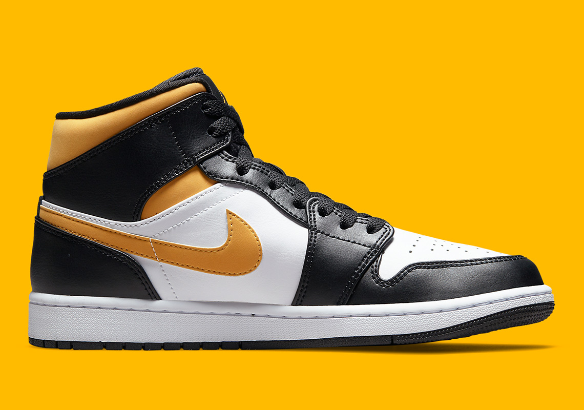 Air Jordan 1 Mid Black University Gold 554724 177 1