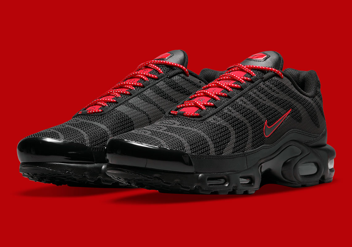 The Nike Air Max Plus Gets Suited In Black Reflective Uppers And Bold Red Accents