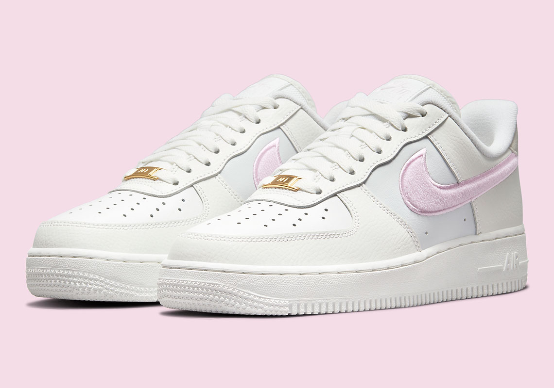 This Women's Nike Air Force 1 Low Features Plush Pink Swooshes