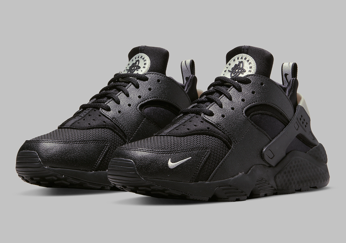 Nike Adds Mini-Swoosh Character To A Black And Grey Huarache