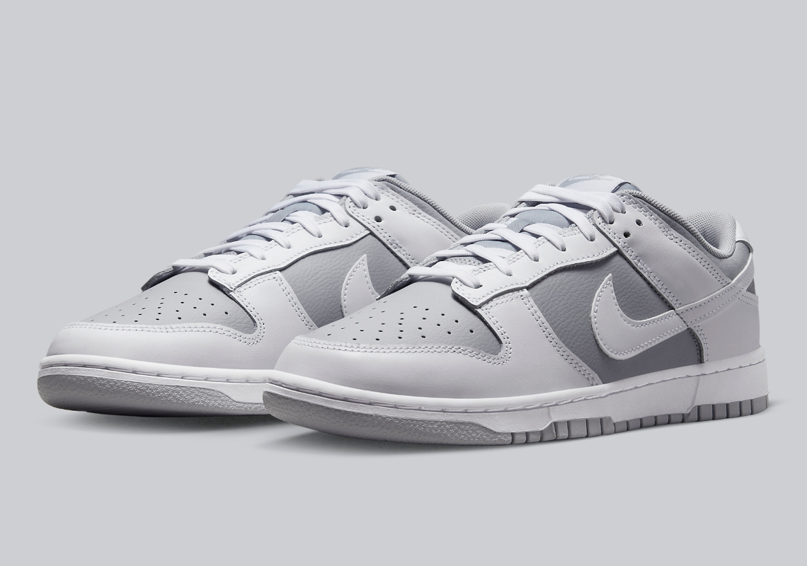 The Nike Dunk Low Appears In A Grey And White Color Combination