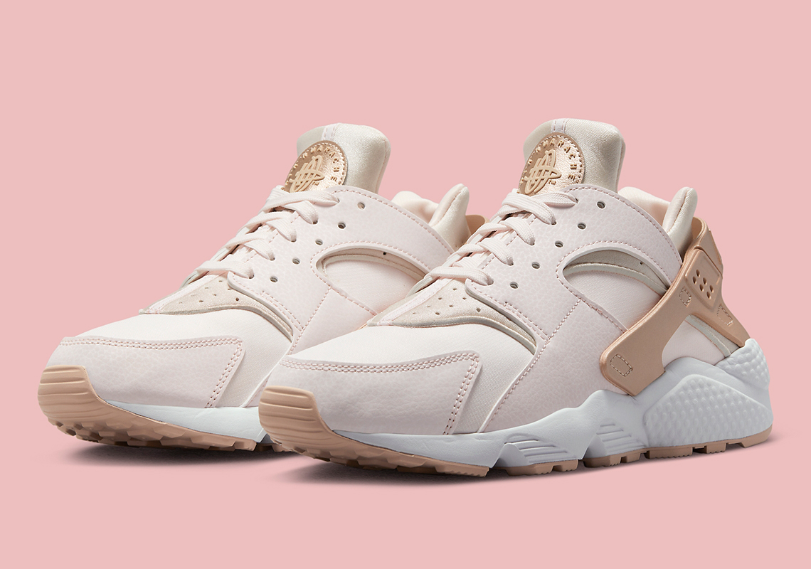 A Metallic Rose Gold Finish Is Applied To This Women's Exclusive Nike Air Huarache