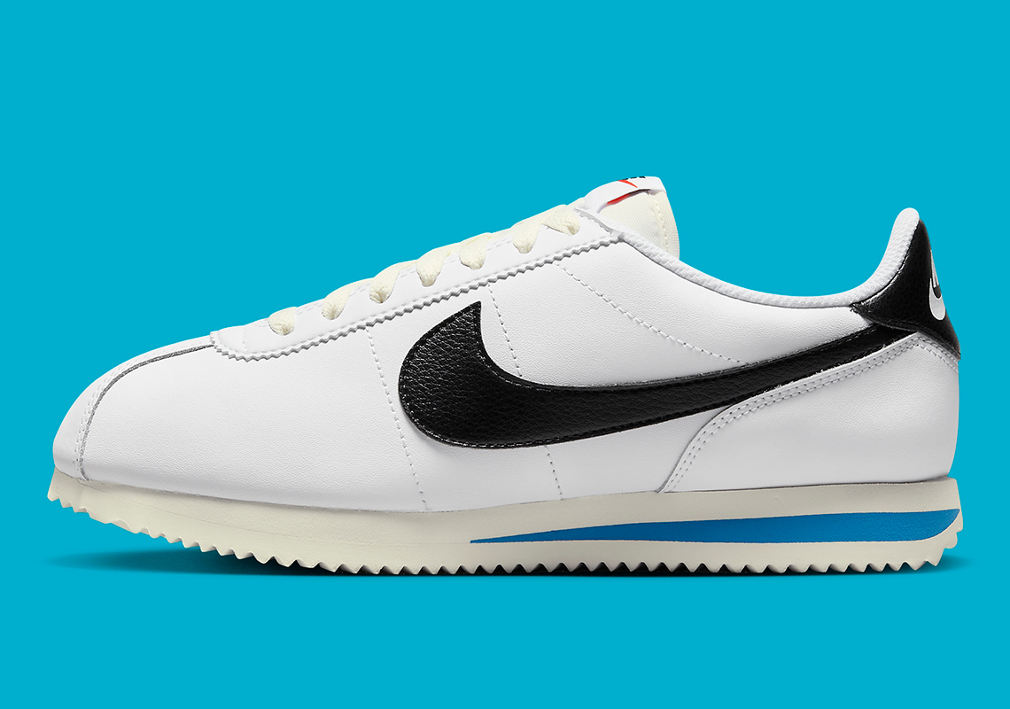 The Nike Cortez "White/Black" Features Blue Flair On The Sole Unit