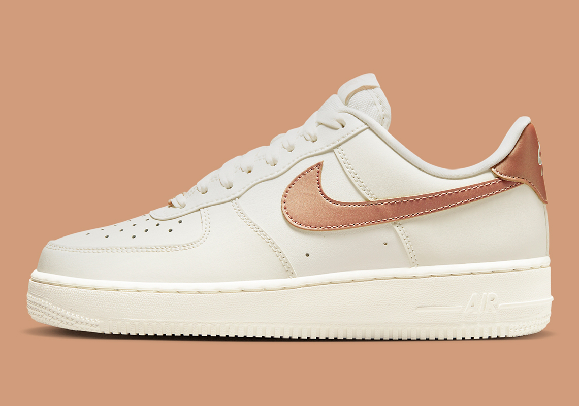 A Premium Rose Gold Finish Outfits This Women's Nike Air Force 1 Low