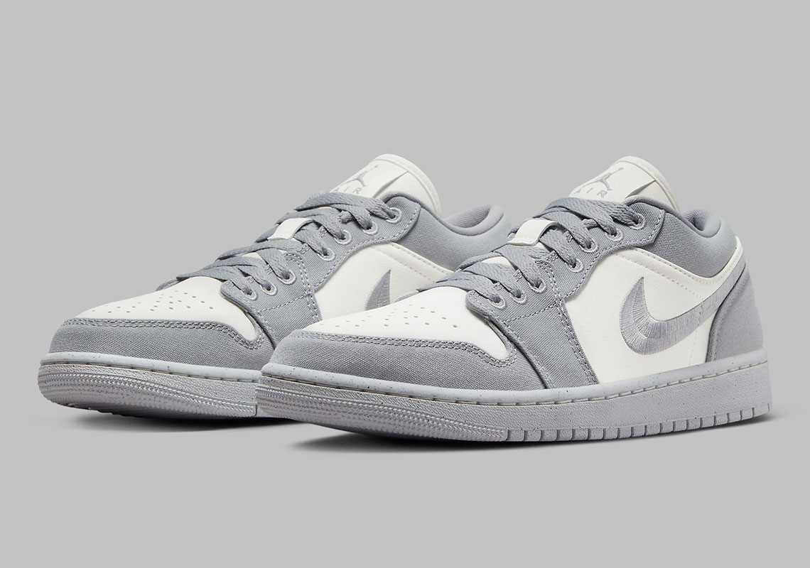 Embroidered Swooshes And Canvas Construction Dress The Air Jordan 1 Low "Steel Grey"