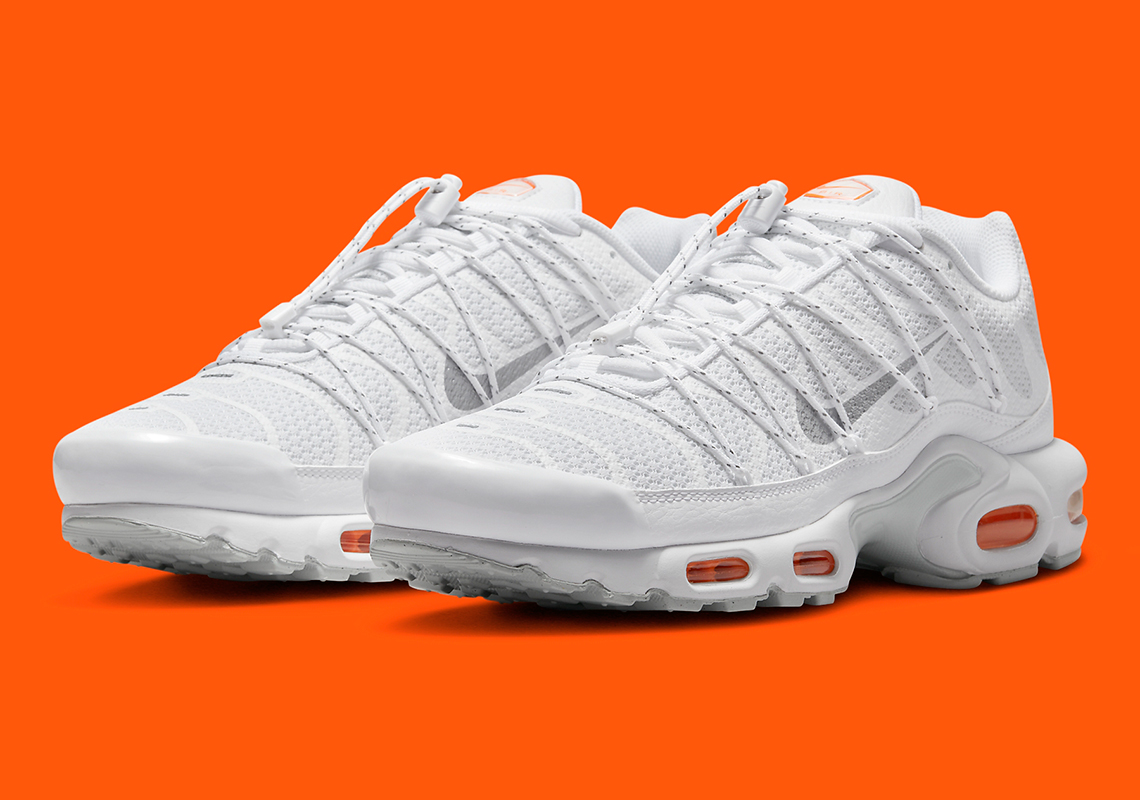 Vibrant Orange Accents Interrupt The Nike Air Max Plus